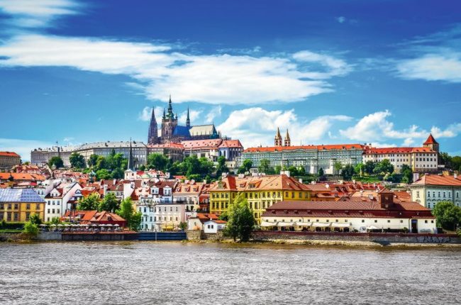 View of colorful old town and Prague castle with river View of colorful old town and Prague castle with river Vltava, Czech Republic