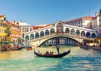 Rialto Bridge in Venice Gondola near Rialto Bridge in Venice, Italy